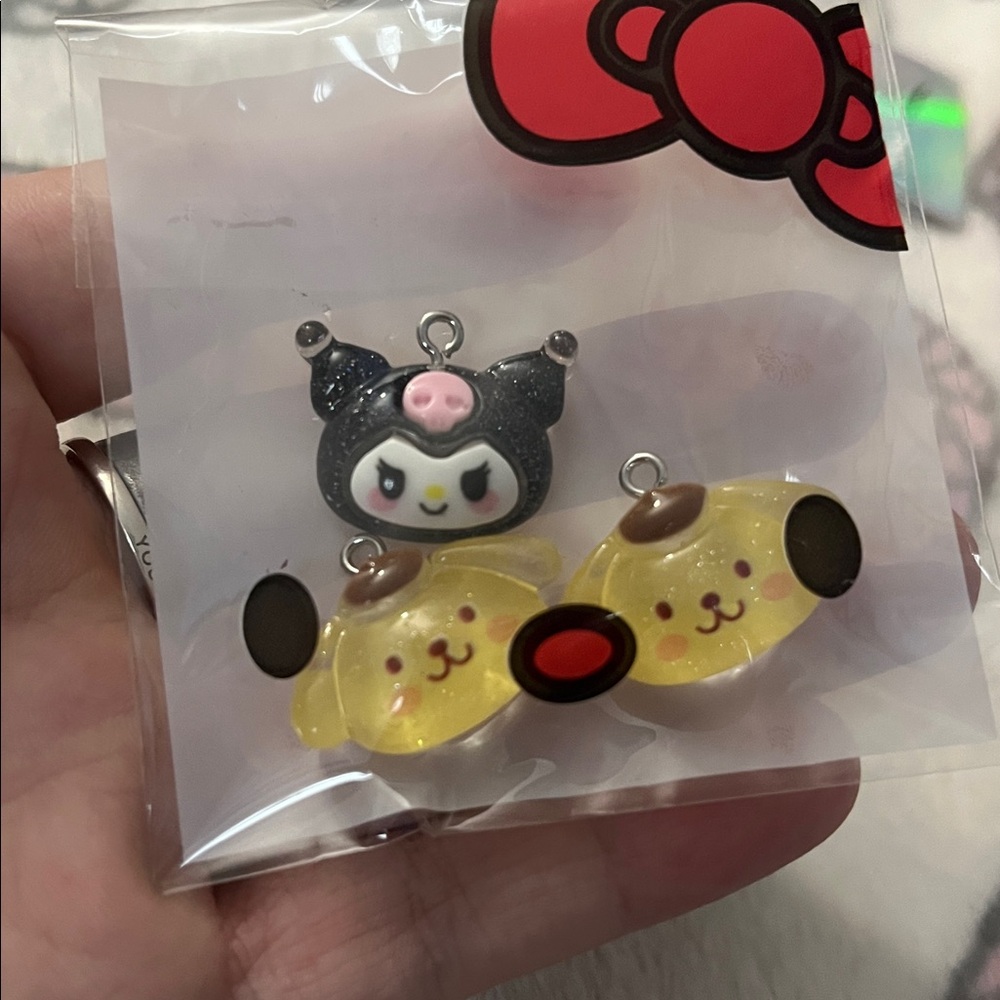 FREE w/ $10+ PURCHASE: Sanrio Kuromi and Pompompurin Pendants
